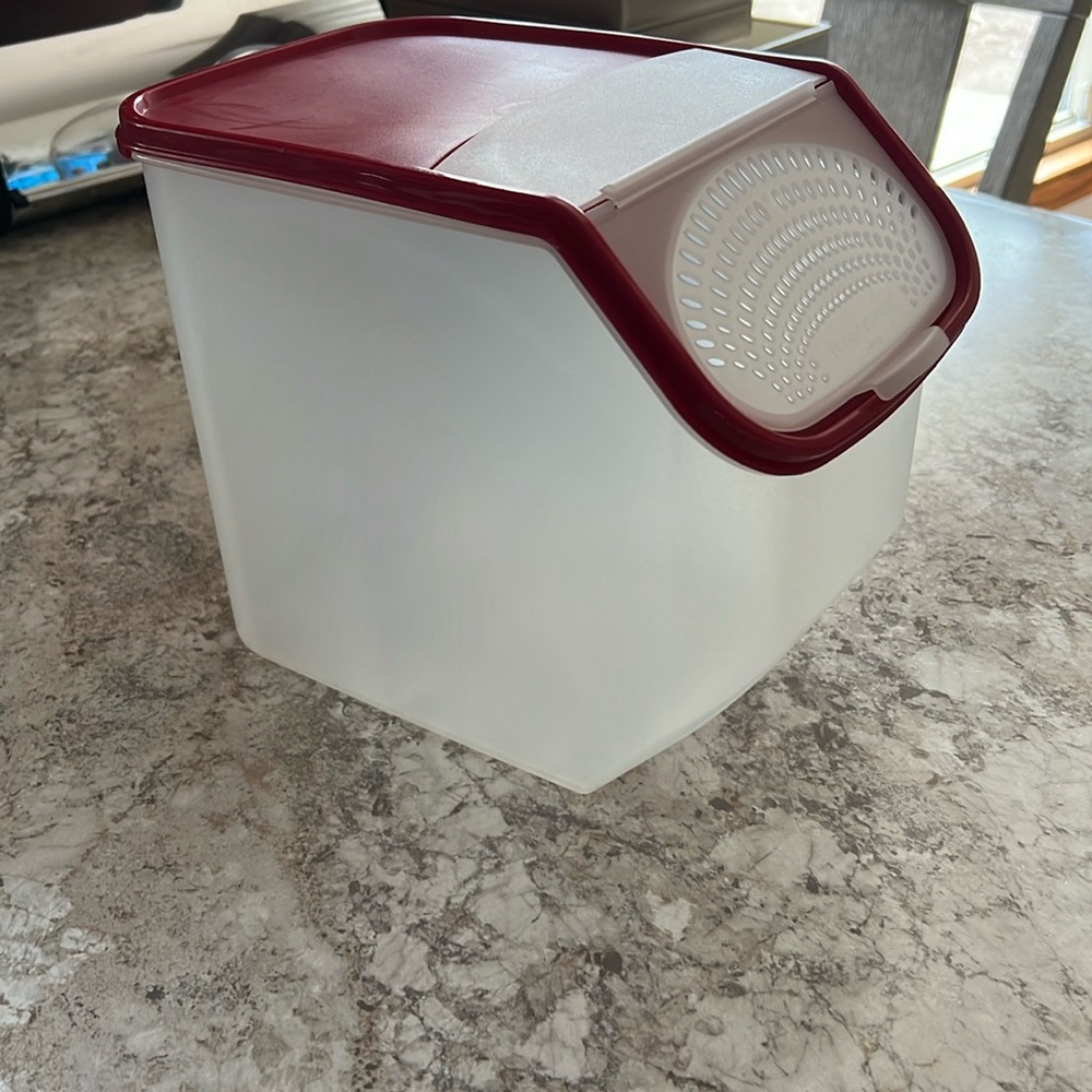 Tupperware container used for storage of potatoes or onions.